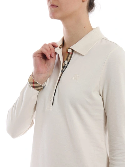 Shop Burberry Zulia Ivory Long Sleeve Polo Shirt In Light Beige