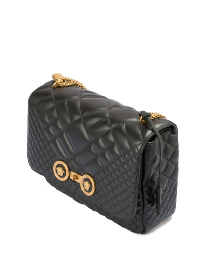 Shop Versace Gold-tone Double Logo Quilted Crossbody Bag In Black