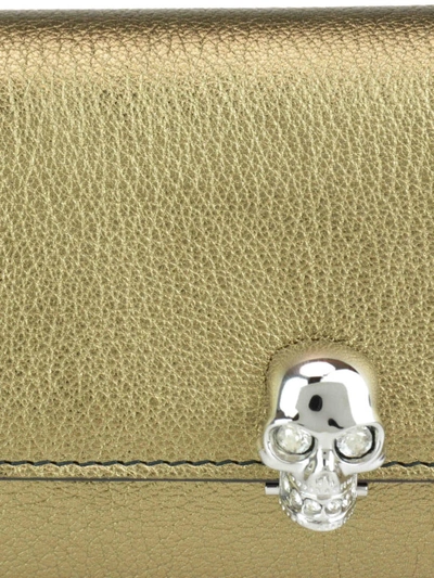 Shop Alexander Mcqueen Gold-tone Metallic Leather Skull Wallet Bag