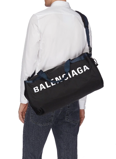 Shop Balenciaga 'wheel' Logo Print Gym Bag