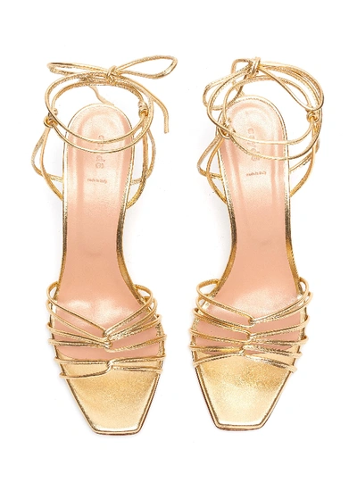 Shop Aeyde 'daisy' Strappy Metallic Leather Sandals In Gold