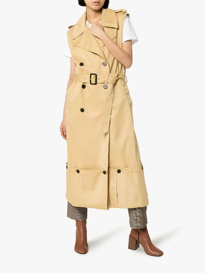 Shop Jw Anderson Fold Up Hem Sleeveless Trench Coat In Brown