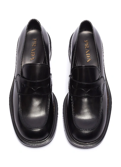 Shop Prada Leather Penny Loafers