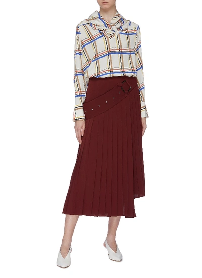 Shop Akira Naka Belted Pleated Staggered Hem Skirt