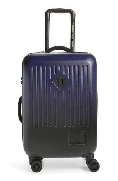 Shop Herschel Supply Co Small Trade 23-inch Rolling Suitcase - Blue In Peacoat/ Black Gradient