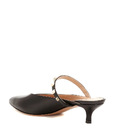 Shop Valentino Rockstud Leather Mules In Black