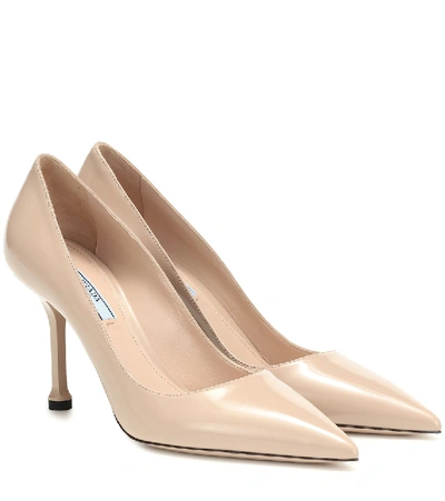 Shop Prada Leather Pumps In Beige