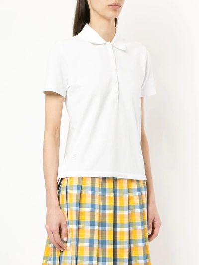 THOM BROWNE RELAXED FIT SHORT SLEEVE POLO WITH CENTER BACK RED, WHITE AND BLUE STRIPE IN CLASSIC PIQ