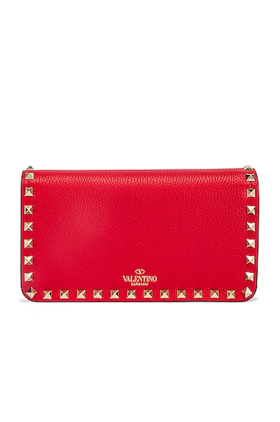 Shop Valentino Rockstud Flap Crossbody Bag In Red