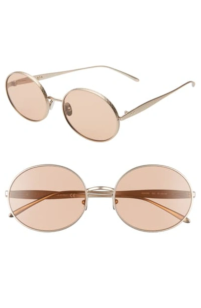 Shop Alaïa 57mm Round Sunglasses In Gold