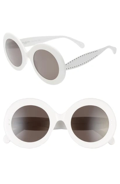 Shop Alaïa 50mm Round Sunglasses In White