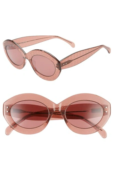 Shop Alaïa 52mm Oval Sunglasses - Nude