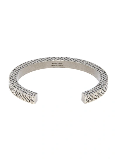 Shop Balenciaga Logo Engraved Brass Cuff In Antique Silver