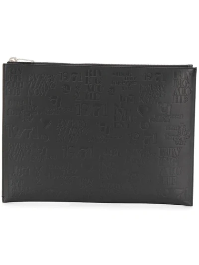Shop Saint Laurent Embossed Logos Clutch Bag In Black