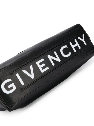 Shop Givenchy Kuriertasche Mit Logo-print In Black