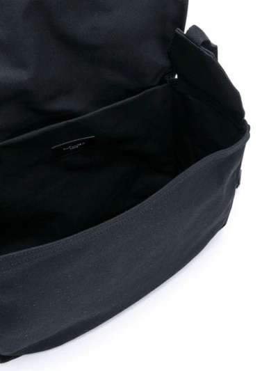 Shop Saint Laurent Strap Detail Messenger Bag In Black