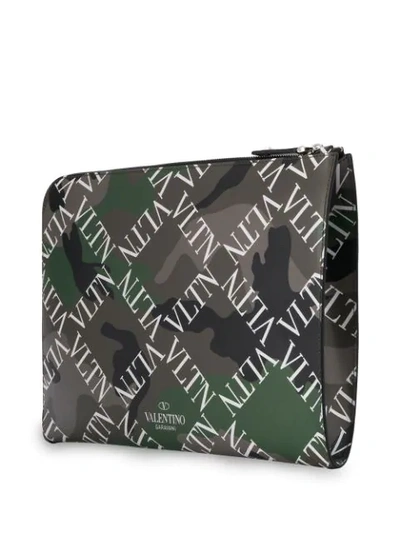 Shop Valentino Garavani Vltn Camouflage Logo Grid Clutch In Green