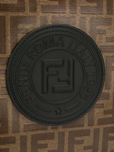 Shop Fendi Ff Monogram Clutch In Brown