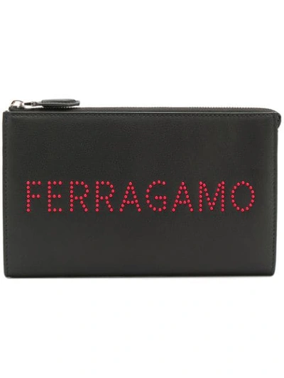 Shop Ferragamo Logo Studded Clutch Bag In Black