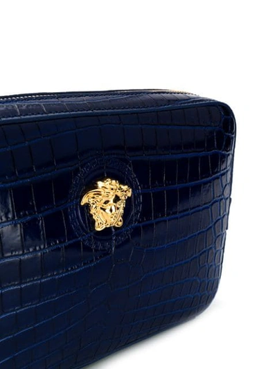 Shop Versace Embossed Crocodile Effect Clutch In Blue