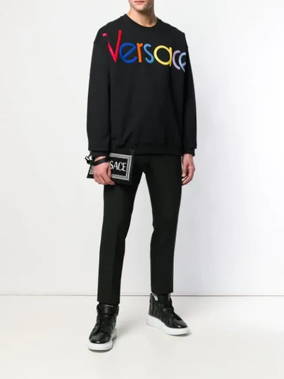 Shop Versace Logo Clutch In Black