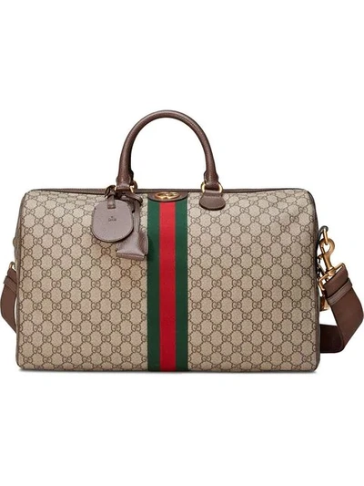 Shop Gucci Ophidia Gg Carry-on Bag - Neutrals