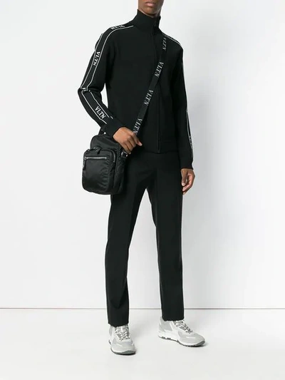 Shop Valentino Vltn Logo Messenger Bag In Black