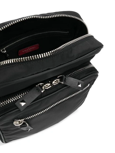 Shop Valentino Vltn Logo Messenger Bag In Black