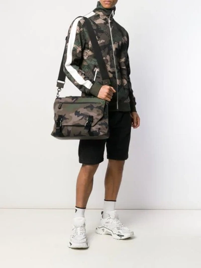 Shop Valentino Camouflage Messenger Bag In Red