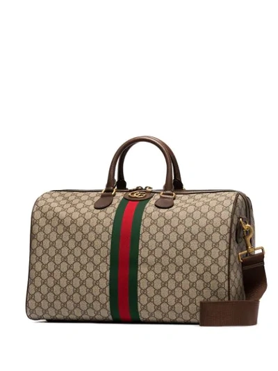 Shop Gucci Gg Supreme Holdall In Brown