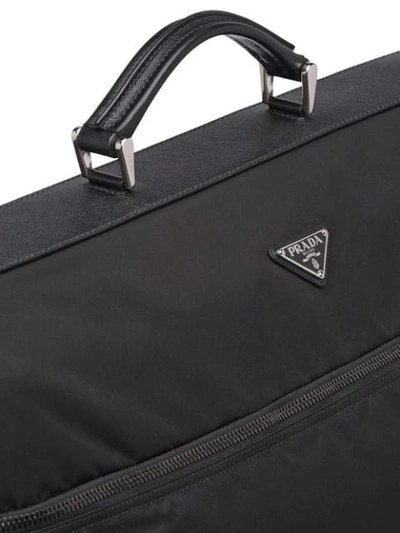 Shop Prada Saffiano Leather And Nylon Garment Bag In Black