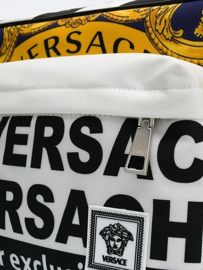 Shop Versace News Print Messenger Bag In White