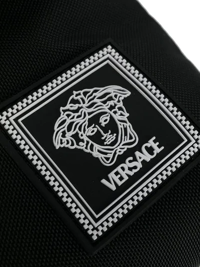 Shop Versace Contrast Stitch Shoulder Bag In Black