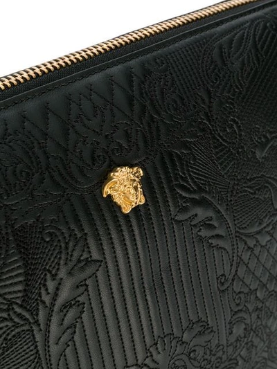 Shop Versace Embossed Messenger Bag In Black