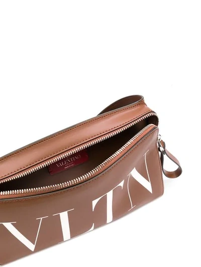 Shop Valentino Vltn Belt Bag In Brown