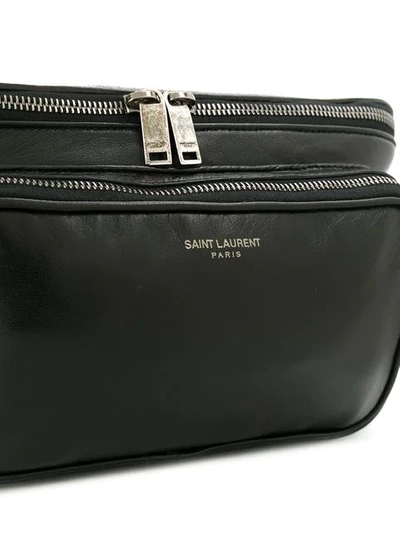 Shop Saint Laurent Logo Print Zipped Belt Bag In Black