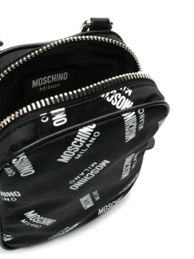 Shop Moschino All Over Logo Messenger In Black