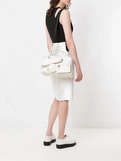 Shop À La Garçonne Multi Pocket Shoulder Bag In White
