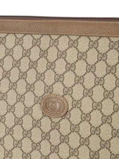 Shop Gucci Monogram Gg Envelope Clutch In Brown