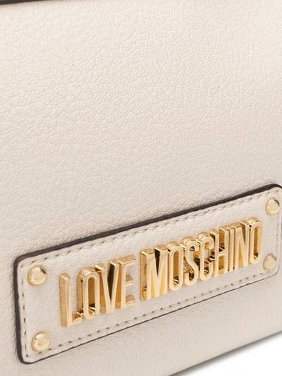 Shop Love Moschino Logo Plaque Crossbody Bag In Neutrals
