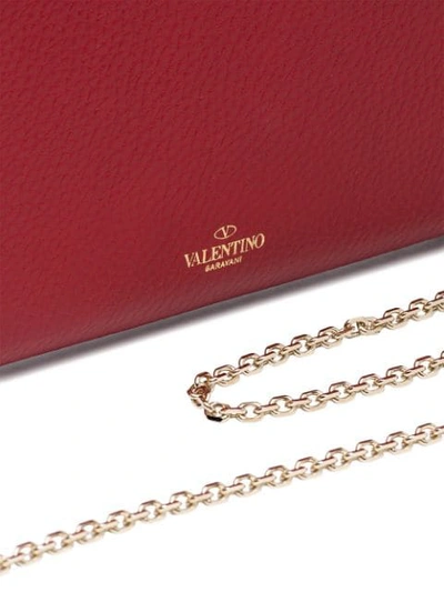 Shop Valentino Garavani Rockstud Clutch In Red