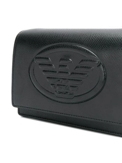 Shop Emporio Armani Embossed Logo Crossbody Bag In Black