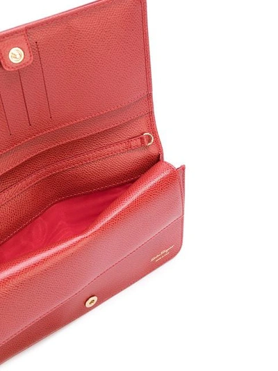 Shop Ferragamo Vara Clutch Bag In Red