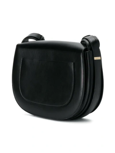 Shop Nina Ricci Disc Buckle Rounded Shoulder Bag In Black