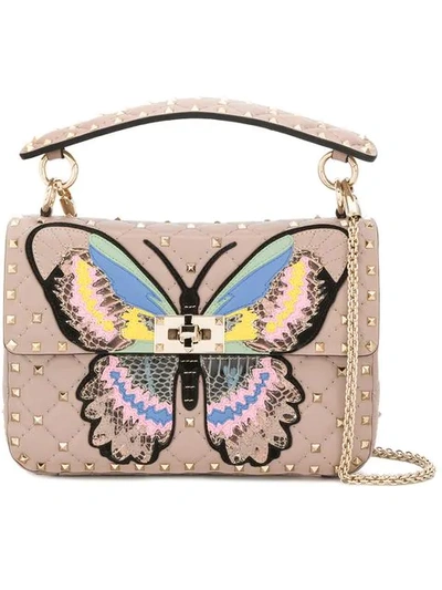 Shop Valentino Garavani Rocktud Spike Butterfly Shoulder Bag In Pink