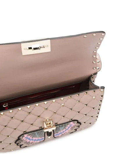 Shop Valentino Garavani Rocktud Spike Butterfly Shoulder Bag In Pink