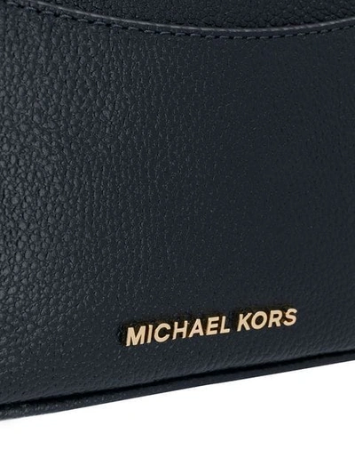 Shop Michael Michael Kors Tassel Belt Bag - Blue