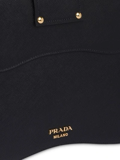 Shop Prada Large Sidonie Saffiano Bag In Black