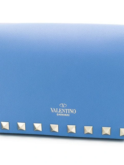 Shop Valentino Garavani Rockstud Clutch In Blue