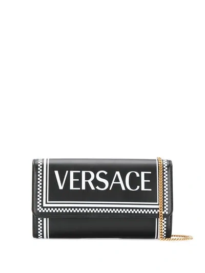 Shop Versace Checkered Logo Crossbody Bag In Black